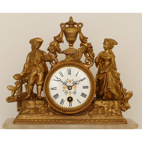 319 - A late 19th century French gilt metal and marble drumhead mantle clock, surmounted with a man and wo... 