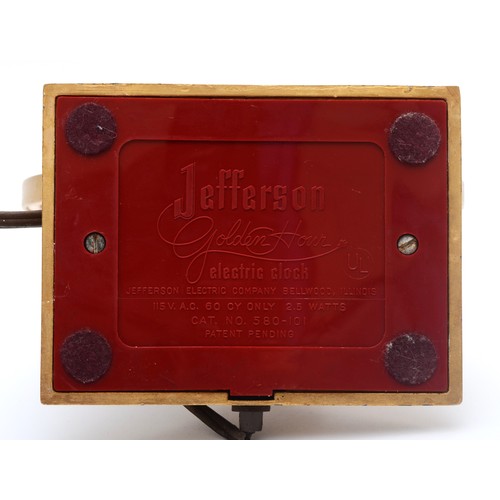 320 - Jefferson Golden Hour electric mystery clock, with brushed brass hands, bezel and base and glass fac... 