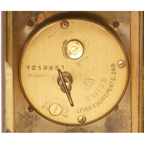 323 - An engraved brass cased mantle clock, the Swiss lever escapement movement striking on a bell with pi... 