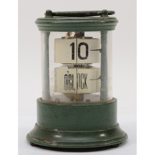 324 - A 20th century flip ticket clock, in a green painted tin and glass cylindrical and glass case, with ... 