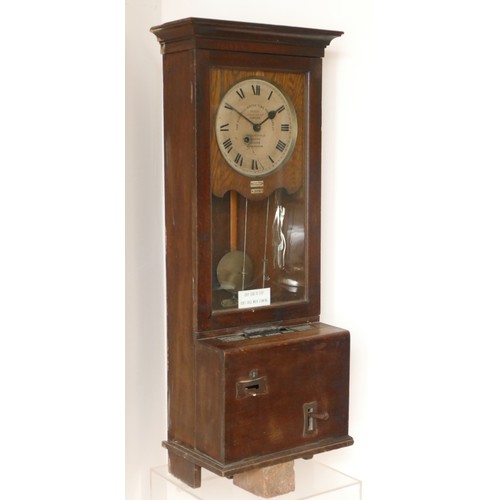 327 - Gledhill Brook Time Recorders LTD, an early 20th century oak cased clocking in machine, the 9