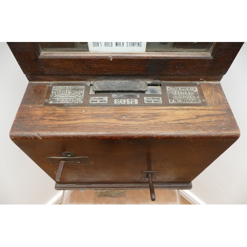 327 - Gledhill Brook Time Recorders LTD, an early 20th century oak cased clocking in machine, the 9