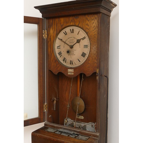 327 - Gledhill Brook Time Recorders LTD, an early 20th century oak cased clocking in machine, the 9