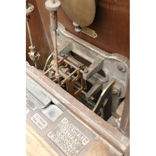 327 - Gledhill Brook Time Recorders LTD, an early 20th century oak cased clocking in machine, the 9