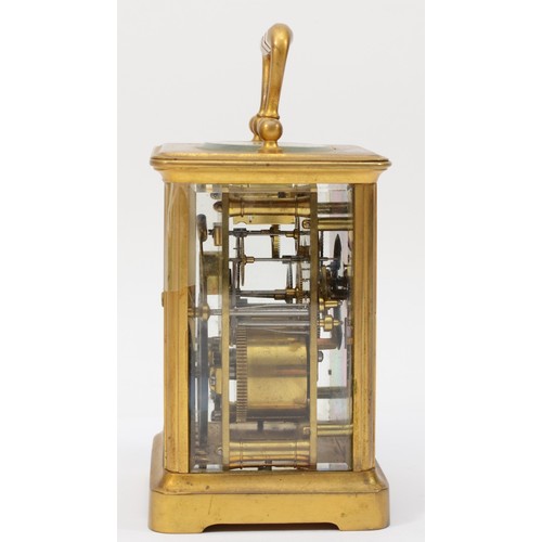 335 - A 20th century brass corniche cased striking carriage clock, striking on the half hour, with applied... 