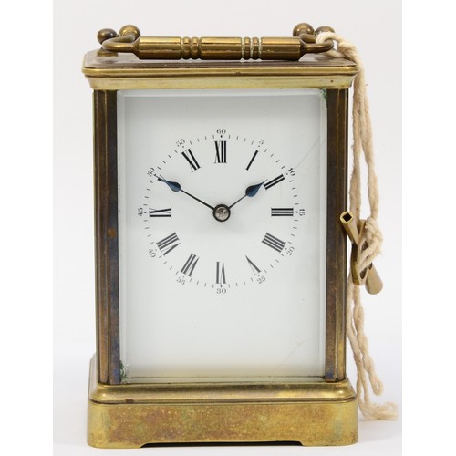 336 - A 20th century brass corniche cased half hourly striking carriage clock, the white dial with black R... 