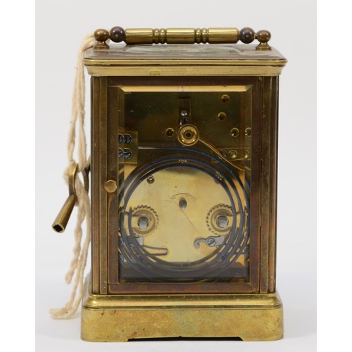 336 - A 20th century brass corniche cased half hourly striking carriage clock, the white dial with black R... 