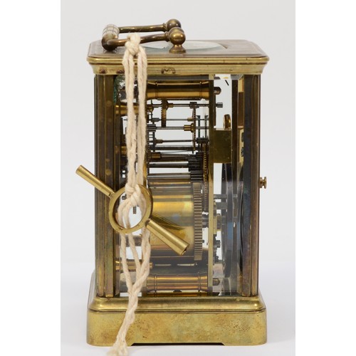 336 - A 20th century brass corniche cased half hourly striking carriage clock, the white dial with black R... 