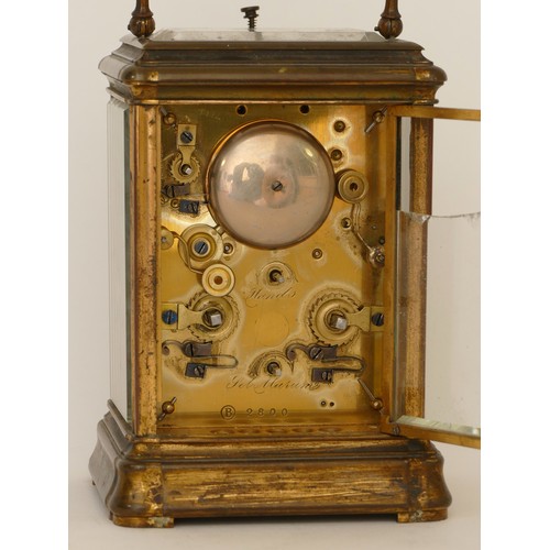 339 - An early 20th century hourly repeater striking brass corniche cased carriage clock, striking on a be... 