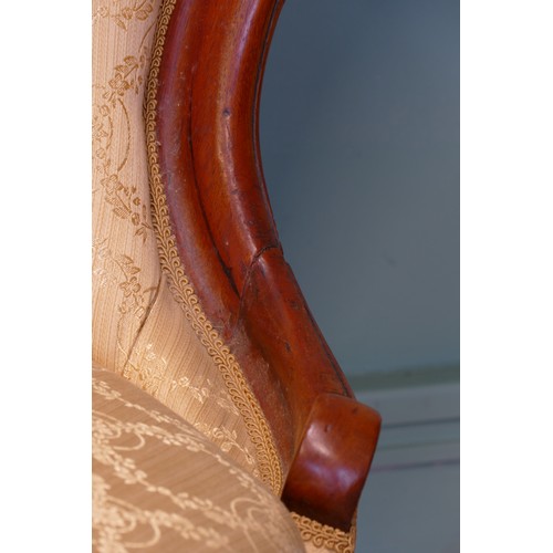 379 - A 19th century mahogany framed button spoon back low nursing chair, raised on carved cabriole suppor... 