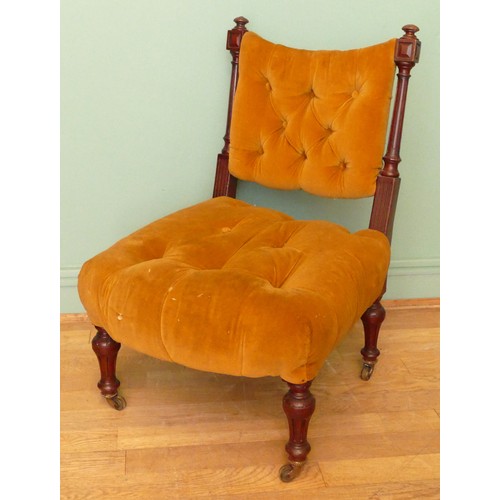 380 - A 19th century mahogany framed button back nursing chair, raised on tapering fluted supports termina... 