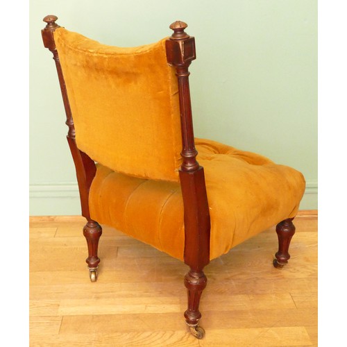 380 - A 19th century mahogany framed button back nursing chair, raised on tapering fluted supports termina... 