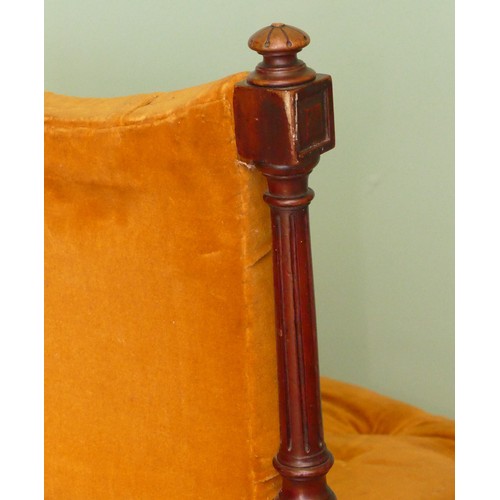 380 - A 19th century mahogany framed button back nursing chair, raised on tapering fluted supports termina... 