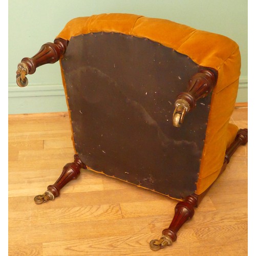 380 - A 19th century mahogany framed button back nursing chair, raised on tapering fluted supports termina... 