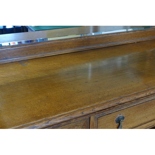 385 - An Edwardian oak mirror back sideboard, the blind fretwork frieze with geometric pattern with mirror... 