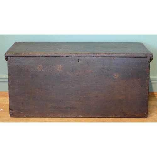 388 - A 19th/early 20th century stained pine tapering twin handled travelling trunk, the hinged lid openin... 