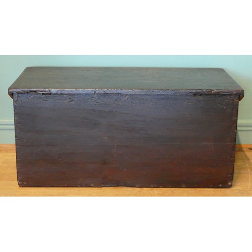 388 - A 19th/early 20th century stained pine tapering twin handled travelling trunk, the hinged lid openin... 