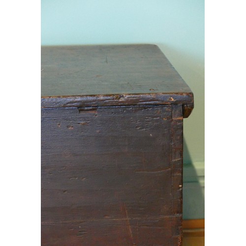 388 - A 19th/early 20th century stained pine tapering twin handled travelling trunk, the hinged lid openin... 