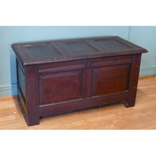 390 - A late 17th century and later oak three panel coffer, raised on stile supports 114 x 54 x 60cm.