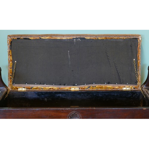 392 - An early 20th century mahogany duet piano stool with shaped and carved supports, upholstered box sea... 