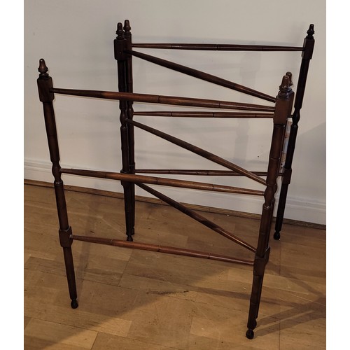 396 - A 19th century mahogany bamboo effect two fold floor standing clothes horse, raised on turned feet, ... 