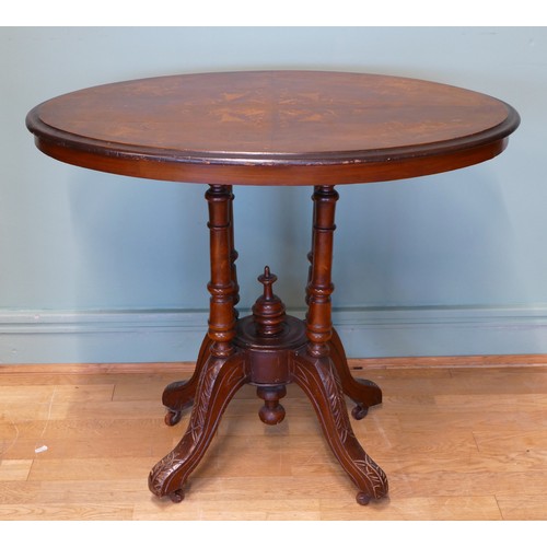 397 - A small Victorian mahogany oval table with floral inlay, on a carved quadripartite birdcage base wit... 