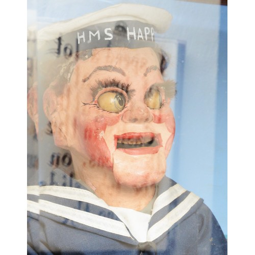 424 - Laughing sailor, HMS Happy, by Modern Enterprises, stained oak cabinet, raised on cast metal feet, 5... 