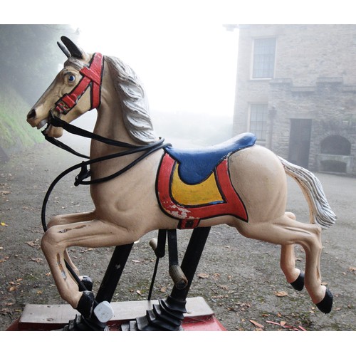 429 - A coin operated painted and cast alloy horse ride, 115 x 53 x 132cm.
Provenance; Watermouth Castle, ... 