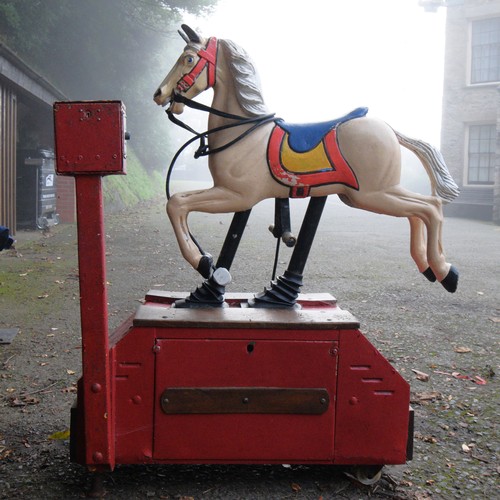 429 - A coin operated painted and cast alloy horse ride, 115 x 53 x 132cm.
Provenance; Watermouth Castle, ... 