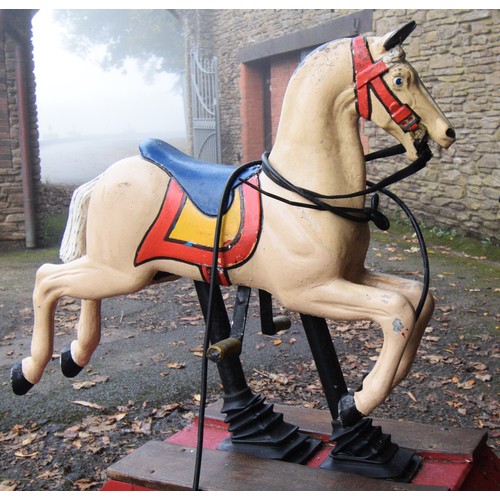 429 - A coin operated painted and cast alloy horse ride, 115 x 53 x 132cm.
Provenance; Watermouth Castle, ... 