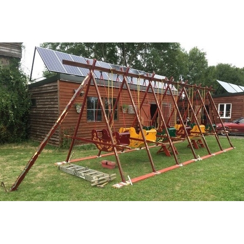 435 - A set of six  Fairground Swingboats, painted maroon. The boats are built from iroko and are in worki... 