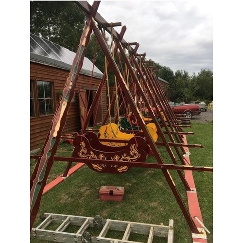 435 - A set of six  Fairground Swingboats, painted maroon. The boats are built from iroko and are in worki... 