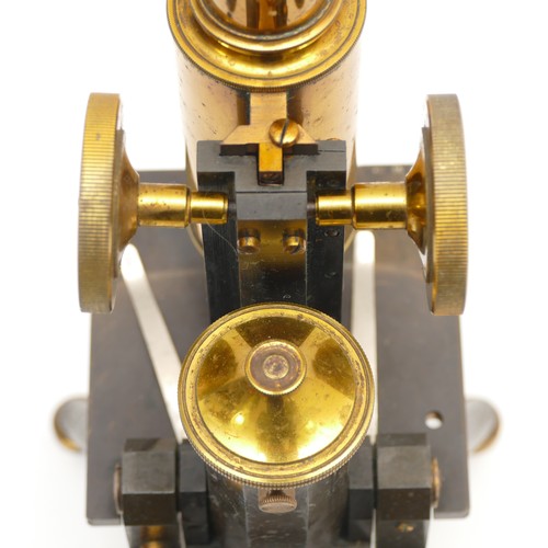 242 - J. Swift & Son; a 20th century brass and black Japanned  microscope, with plano-concaved mirror, rai... 