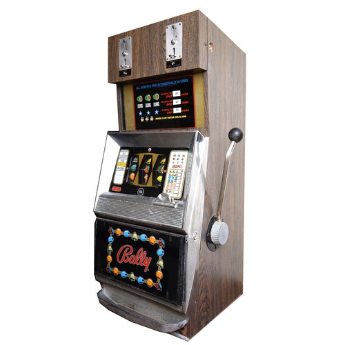 402 - Bally, an electromechanical three reel and hold slot machine, c.1965/70, with 20p and £1 change abov... 