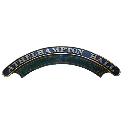 Athelhampton Hall, a brass and enamel steam locomotive nameplate, (B.R. Number 6971), 194cm. 
This engine was built at Swindon in 1947, one of only 71 Hawksworth Modified Halls, compared to the 330 Hall class locomotives. It was allocated to Bristol (Bath Road) and Birmingham (Tyseley), withdrawn from service in 1964, being scrapped the following year by Cashmores (Great Bridge).
The nameplate is unusual in that it is 9" longer than the normal plates due to the number of letters in Athelhampton.
Provenance; After the locomotive was scrapped both nameplates were bought by Robert Cooke, the owner of Athelhampton Hall in Dorset. In 2019 his grandson, Patrick Cooke, who had inherited the Hall in 1992, retired and sold the contents through Dukes of Dorchester. This plate was lot 493 in the auction in October 2019. Please note the position of the mounting holes on the splash plate of both lots 493 and 494 in that auction.