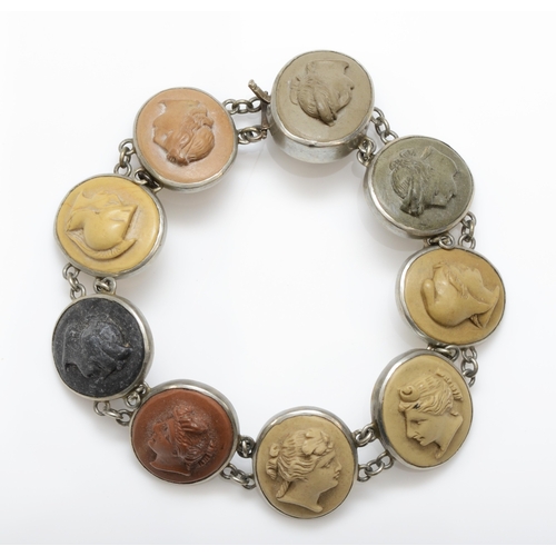 A Victorian silver carved lava cameo sectioned bracelet, decorated with nine female busts in profile, unmarked, cameos 18mm, 19.5cm, 19gm.