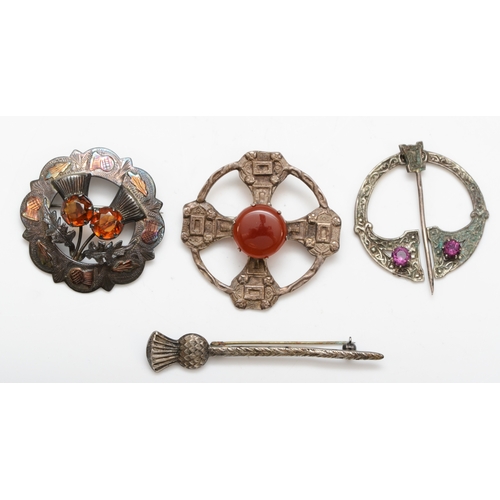 A Scottish silver carnelian Celtic brooch, by Robert Allison, Glasgow 1959, 48mm, together with another Scottish silver paste set thistle brooch, by Ward Brothers, Glasgow 1953, a silver thistle brooch, by Ortak Silvercraft, Edinburgh 1979, and a silver paste set pin brooch, by H Wright & Son, Edinburgh 1958, 46gm.