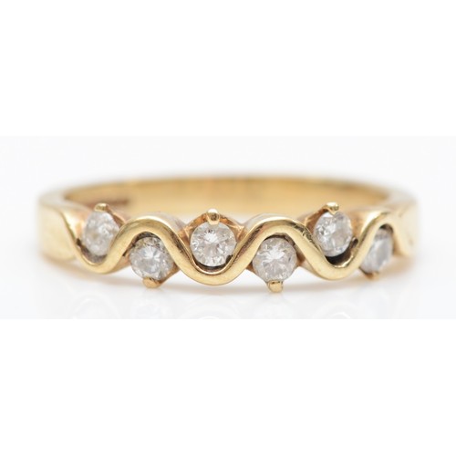 A 9ct gold brilliant cut diamond dress ring, L, 2.3gm.