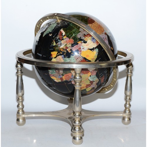 61 - A 20th century polished hardstone terrestrial globe, 38cm high.