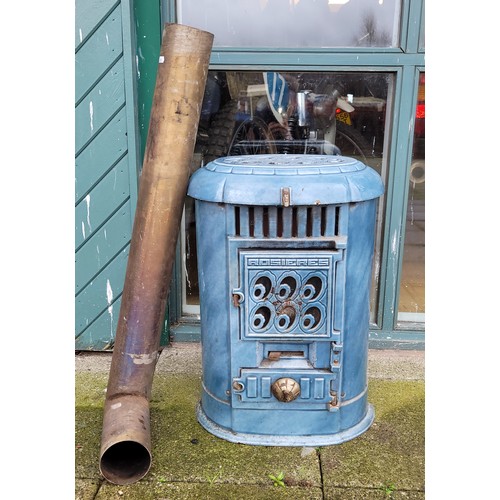 64 - A Victorian style blue painted cast iron fire/heater with brass chimney, 65cm high.