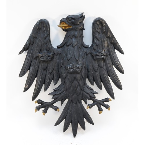 Architectural; A bronze 'Barclays Bank' wall plaque, circa mid 20th century, depicting a black spread eagle, having three ducal cornet crowns, one on each wing and one to its chest, with gilt detail. 51x45cm, approximate weight 10kg.