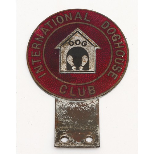 106 - An International Doghouse Club car badge, c.1960, in red enamel with kennel design to the centre.