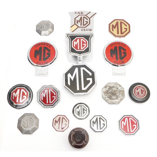 115 - An MG Bakelite ashtray and thirteen various MG badges