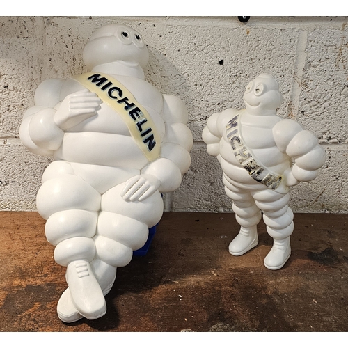 140 - A Bibendum or Michelin Man plastic seated lamp, lacking lighting, 50cm and a standing example, 31cm ... 