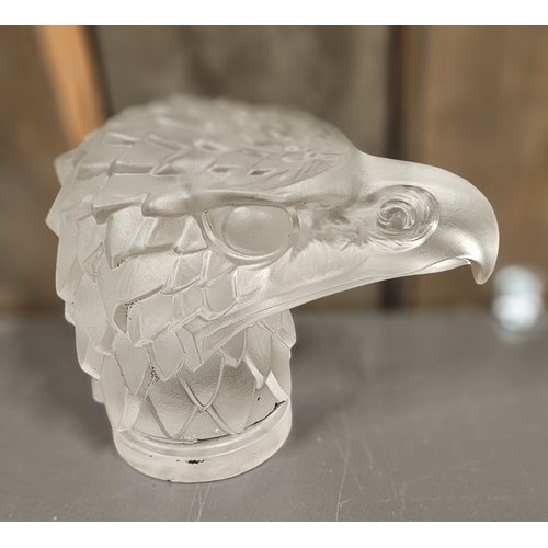 141 - A Lalique style eagles head moulded glass car mascot, impressed Made in Czechoslovakia, 12cm