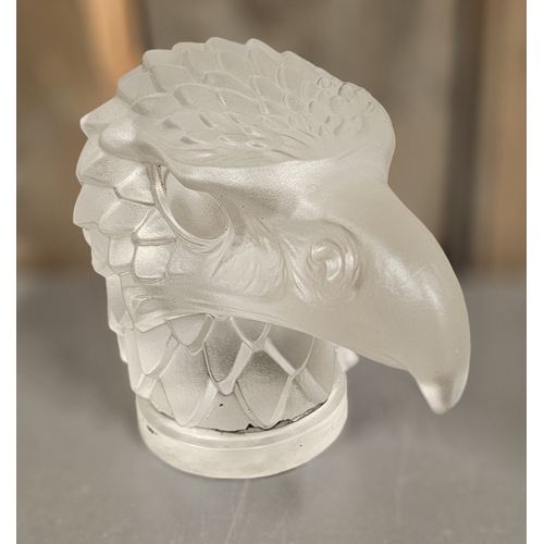 141 - A Lalique style eagles head moulded glass car mascot, impressed Made in Czechoslovakia, 12cm