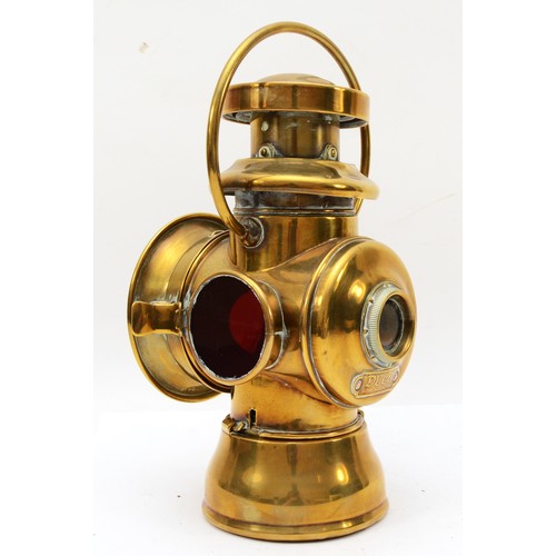 145 - A brass era Duco by Brown brothers oil fired side lamp, 29cm.