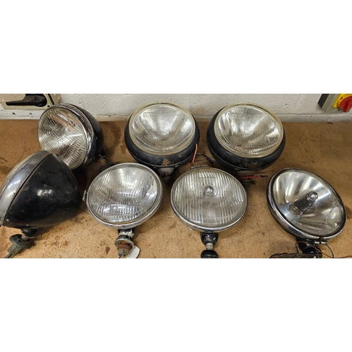 149 - A pair of Cibie Super Oscar spot lamps, a pair of Lucas 700 headlamps and three other lamps