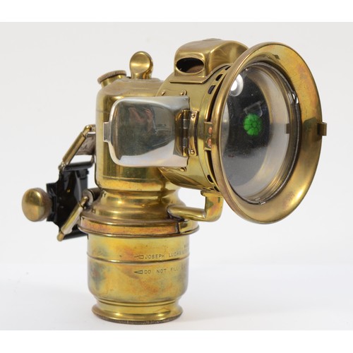 155 - A rare Lucas Garda carbide brass car lamp with side rear red lens