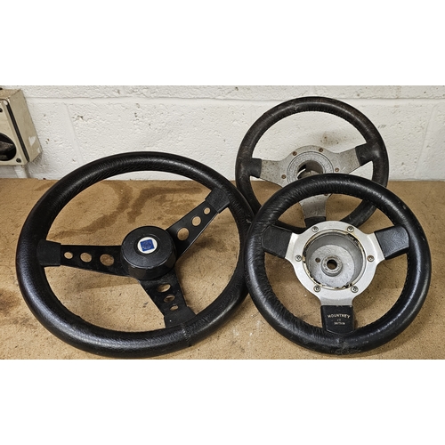 220 - A Mountney leather rim small steering wheel, a BL example and an un-named example (3)